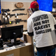 A supporter of Republican candidate for U.S. Senate Herschel Walker looks at the guns for sale at the Governors Gun Club in Kennesaw, Ga., Monday, Dec. 5, 2022, before the start of a Walker campaign rally.